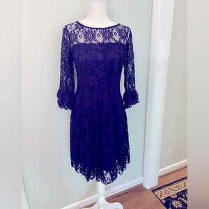 Stunning lined purple cocktail dress with lace overlay!